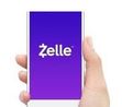 Zelle App with blue background on phone in hand